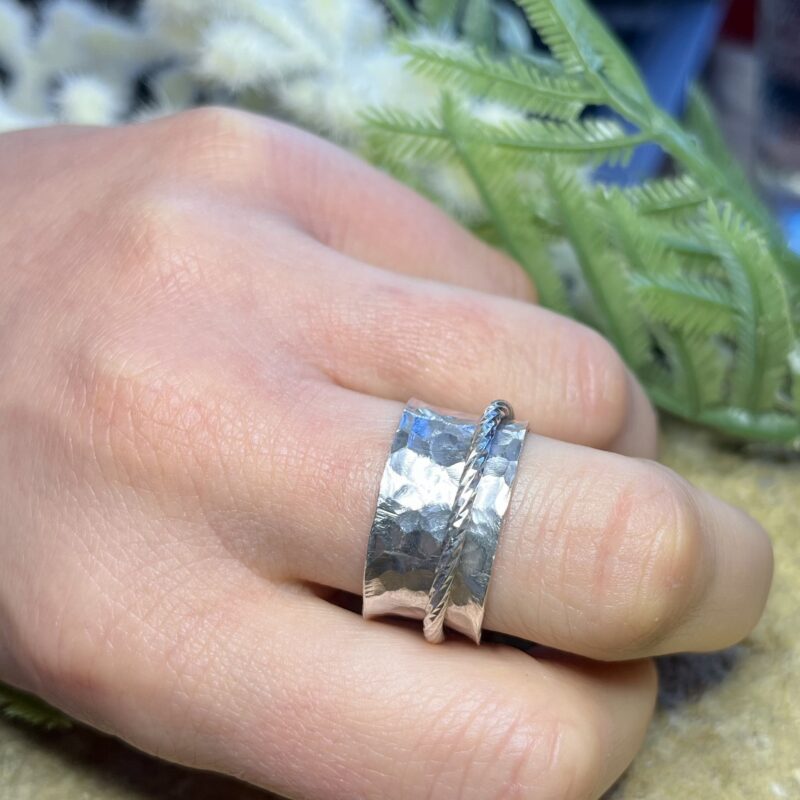 Handmade silver spinner ring with a diamond cut insert hand modelled Handmade silver spinner ring with a diamond cut insert hand modelled