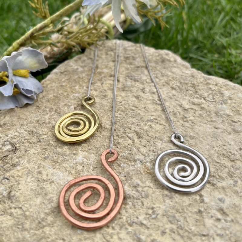 Handmade spiral necklace available in copper silver and brass