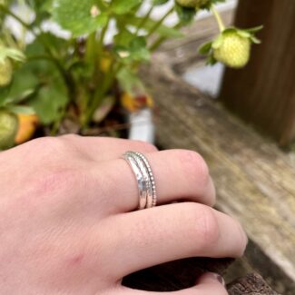silver textured ring set worn